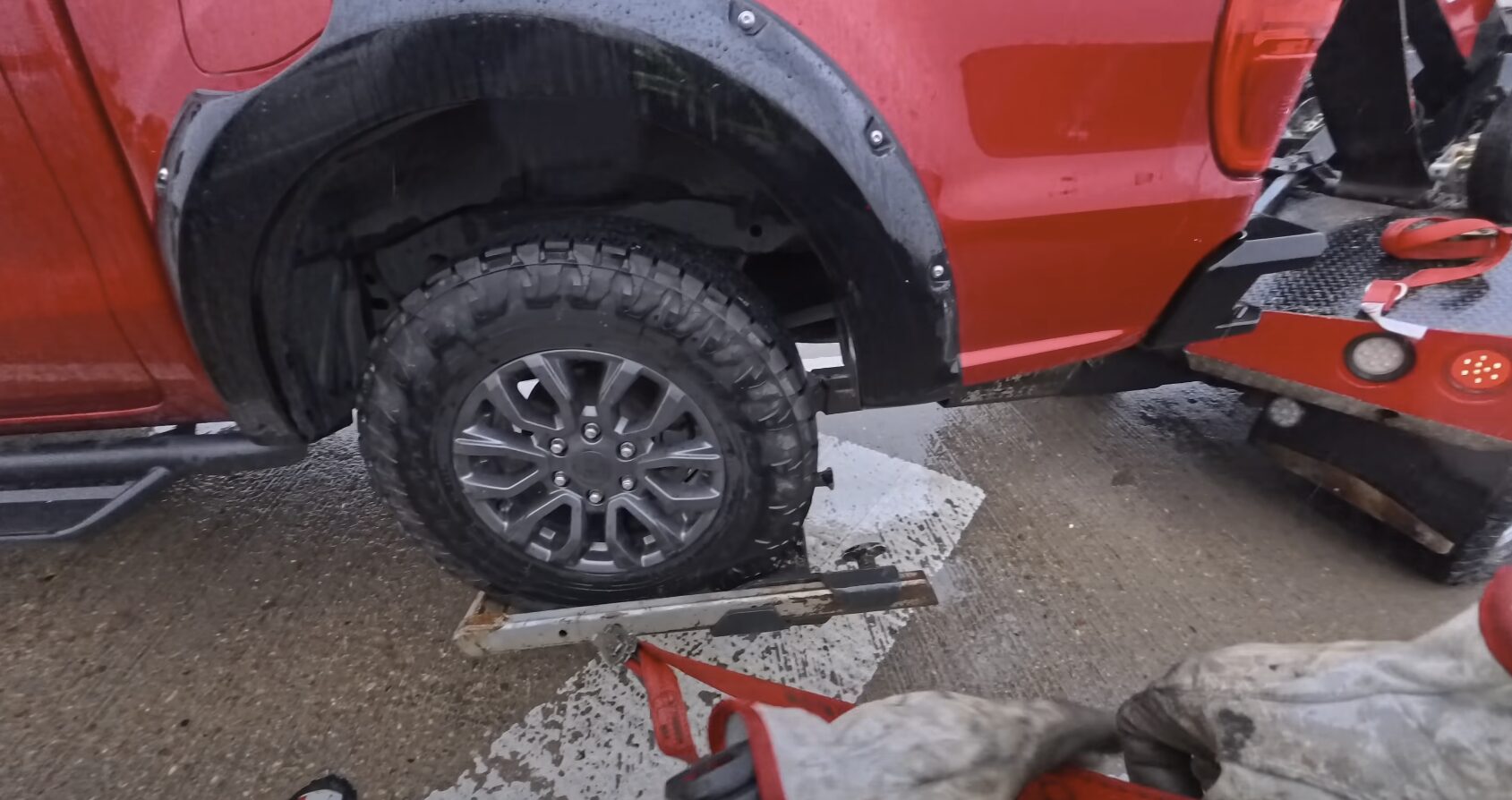 Flatbed tow truck with vehicle secured